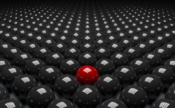 Красный шар среди черных 3D шаров
